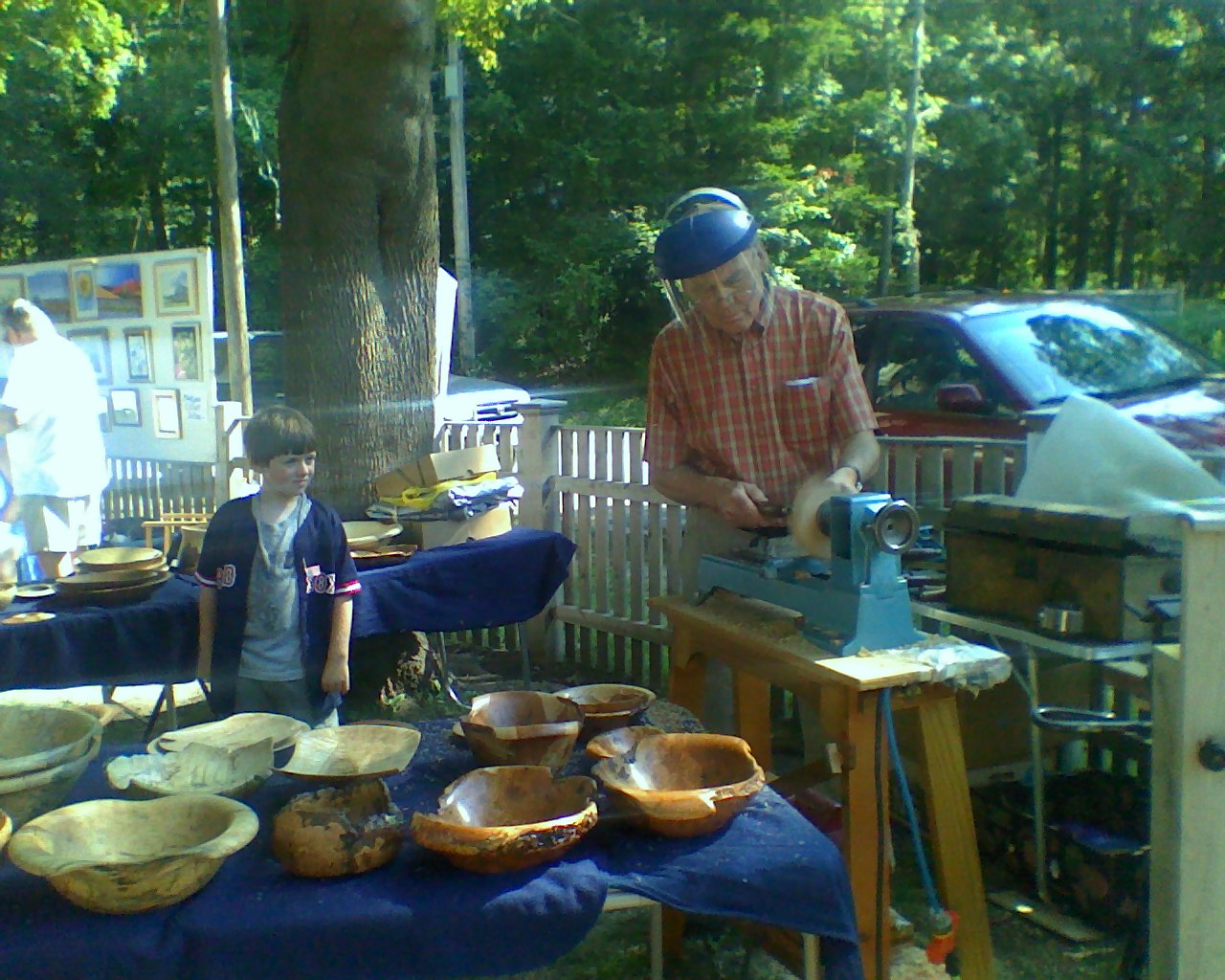 Jeff Tubman at CAF turning wood bowls with Isaac York.jpg